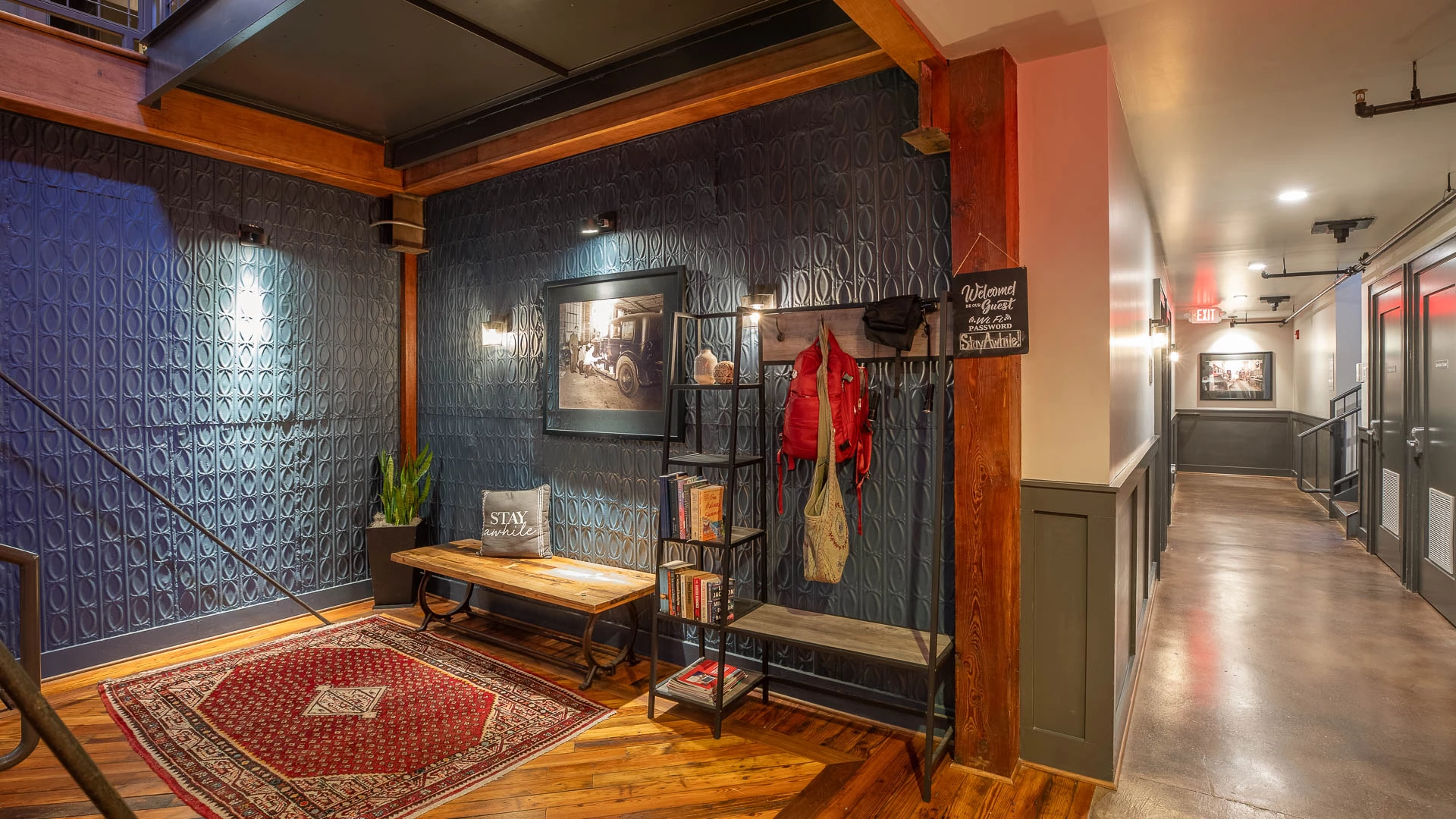 a room with a bench and a coat rack