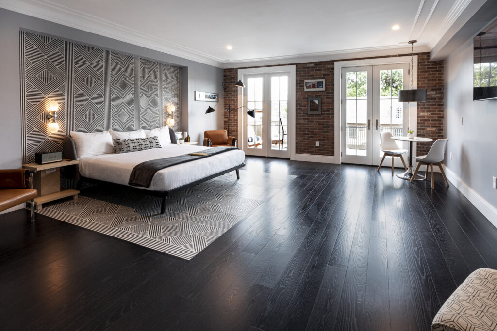 a bedroom with a bed and a table