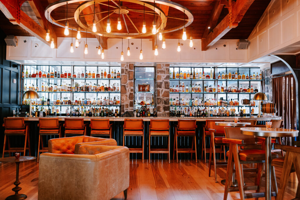 a bar with a large counter and chairs