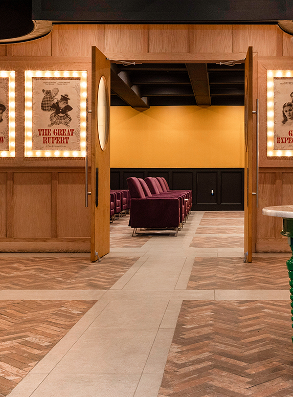 a room with chairs and posters