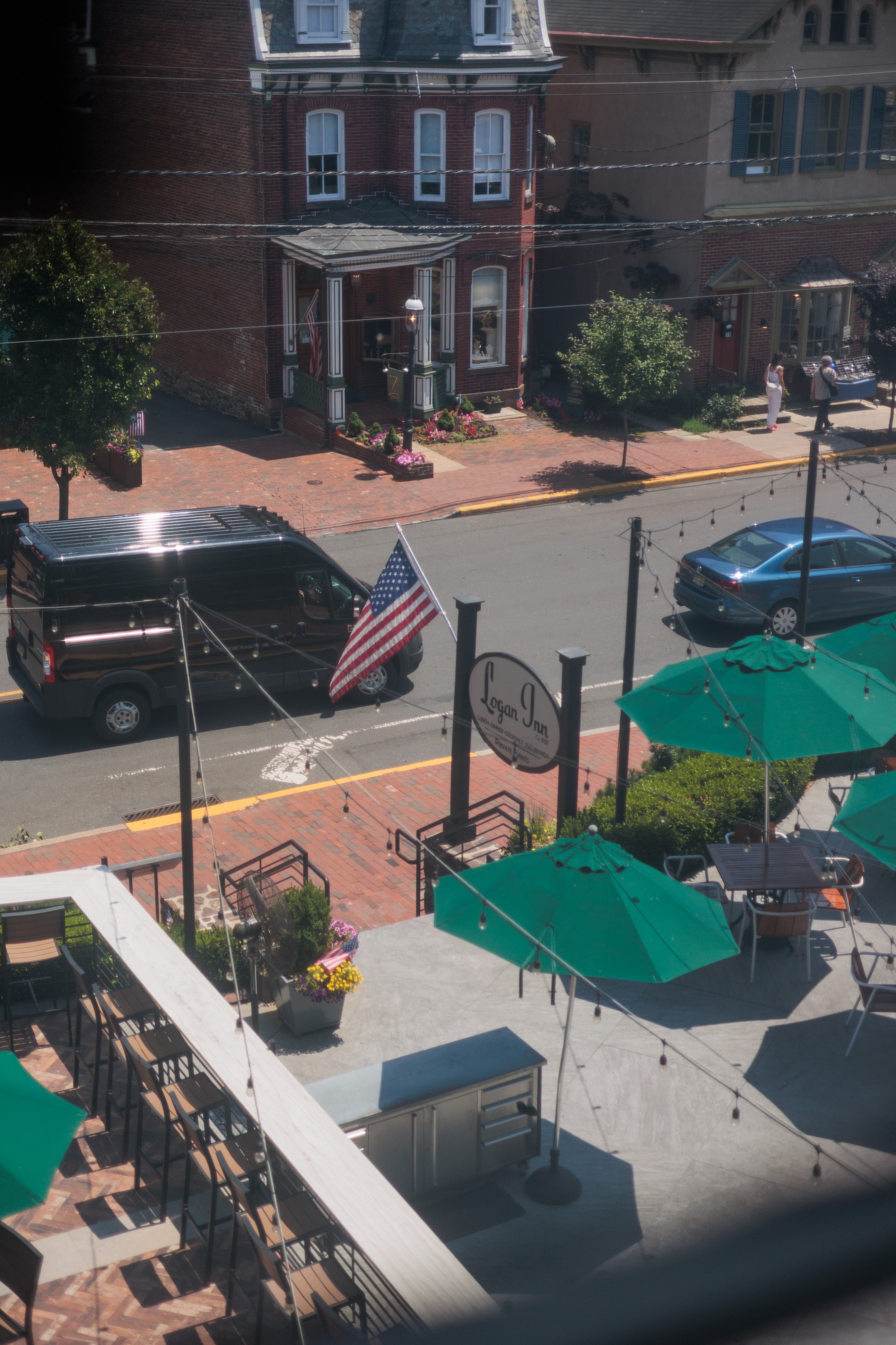 a street with a flag and cars