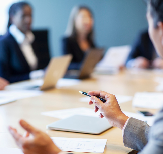 a close-up of a person holding a pen