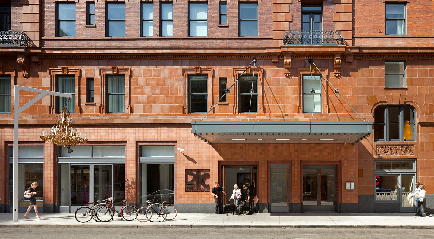 a group of people standing outside of a building