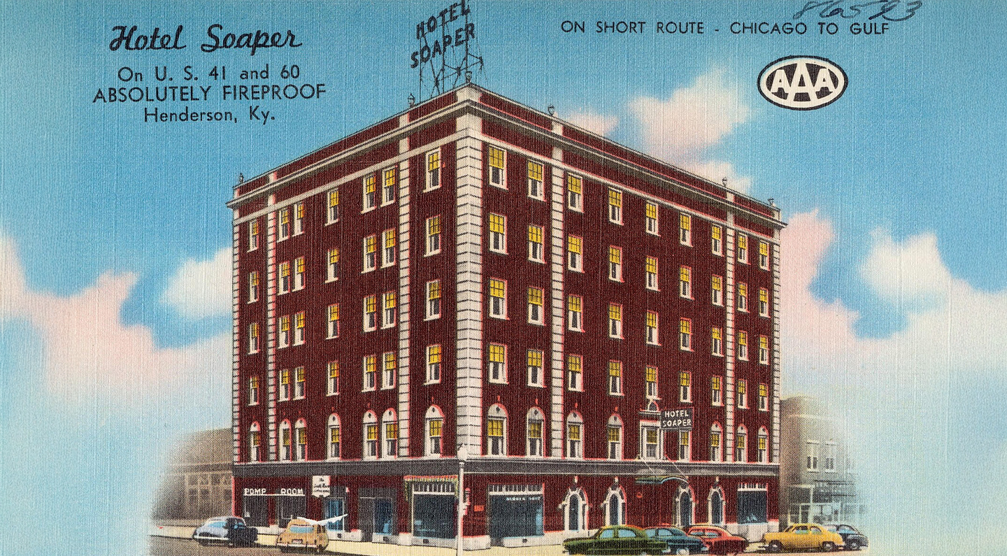 a building with cars parked on the side