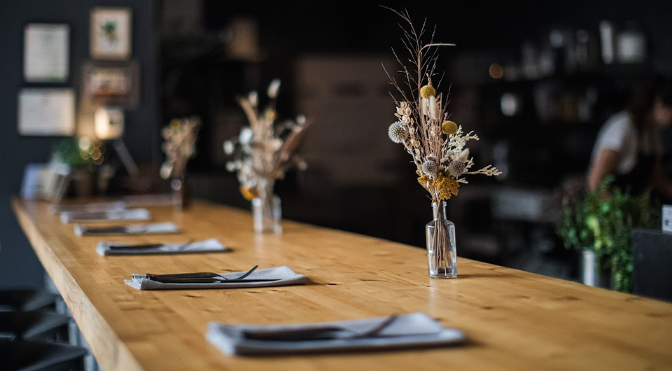 a table with a vase of flowers