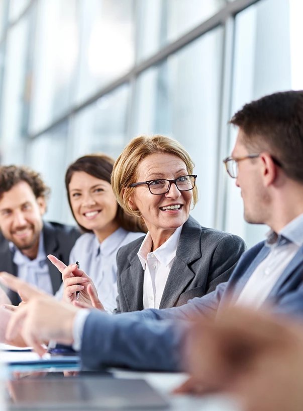 a group of people sitting at a table
