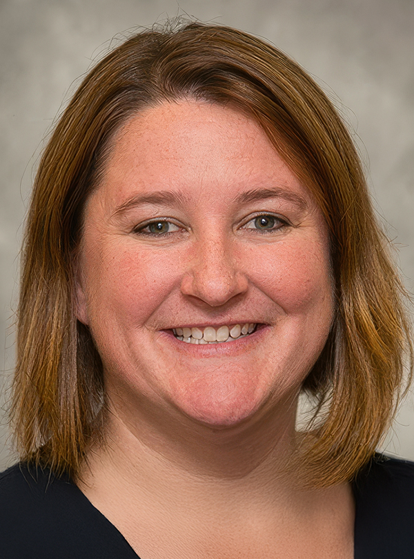 a woman smiling at the camera