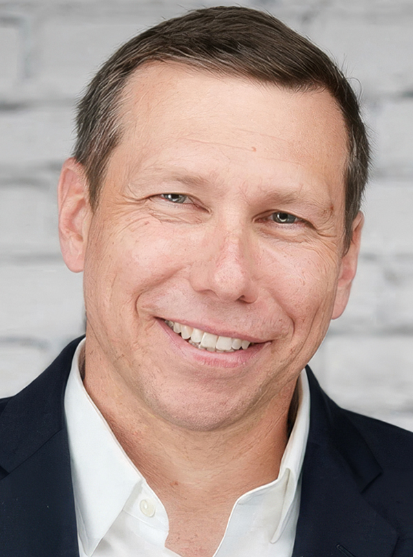 a man smiling for a picture