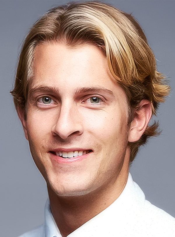 a man with blonde hair smiling