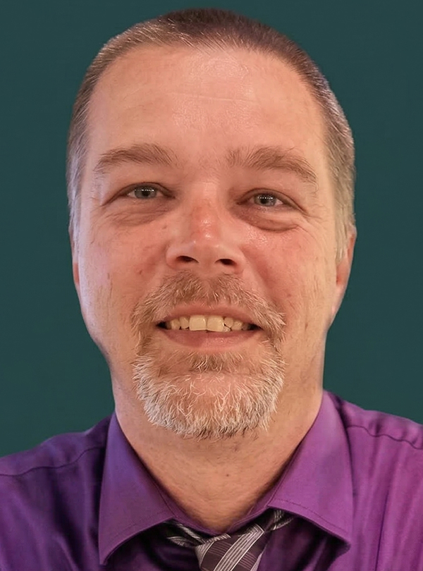 a man in a purple shirt