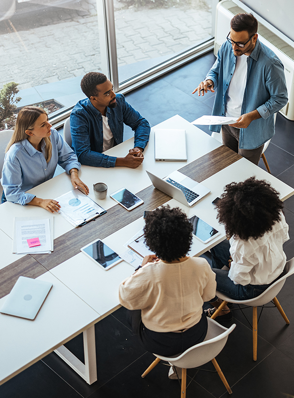 a group of people sitting around a table