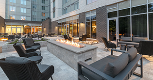 a fire pit in front of a building