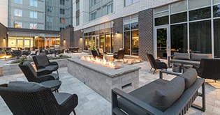 a fire pit in front of a building