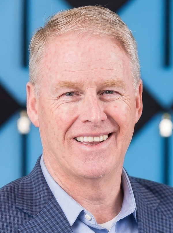 a man smiling at the camera