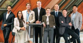 a group of people posing for a photo