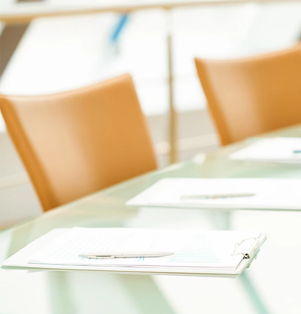 a pen and papers on a table