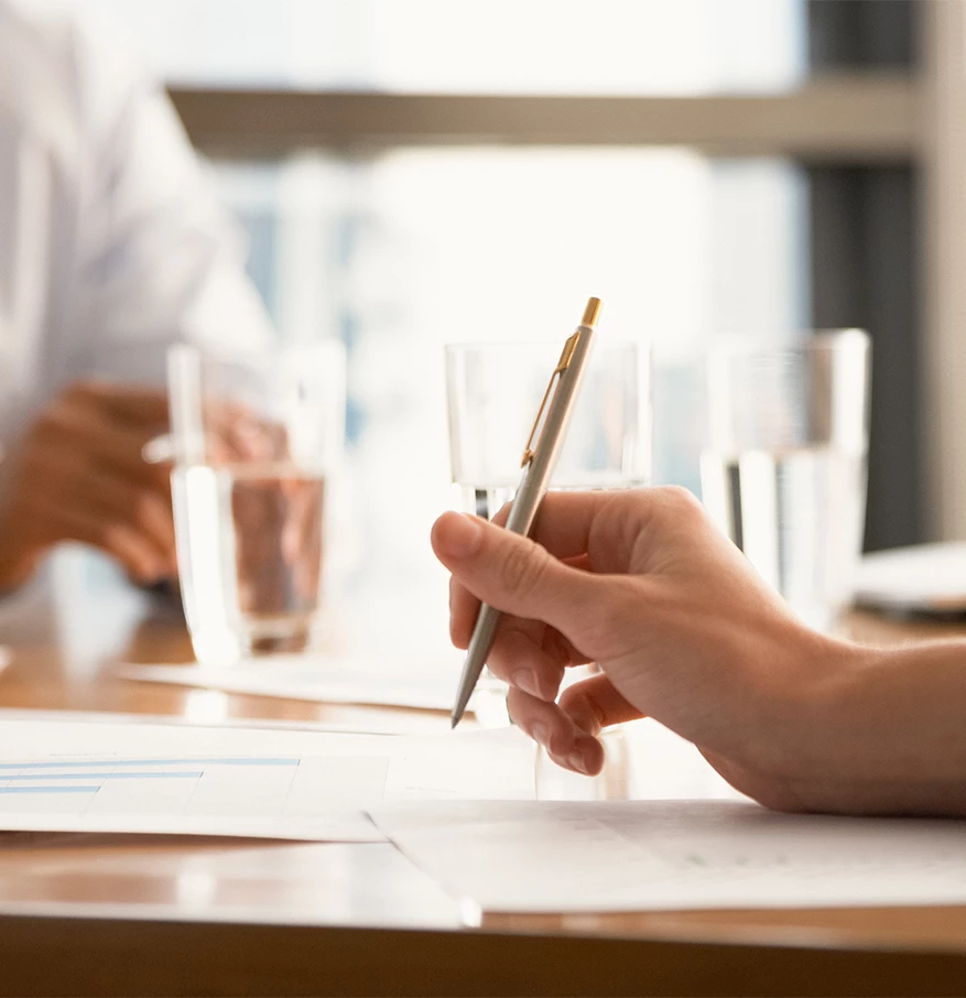 a person holding a pen