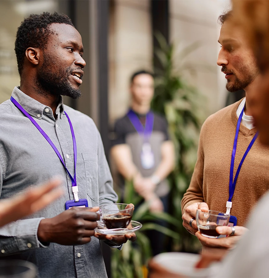 a group of people talking to each other