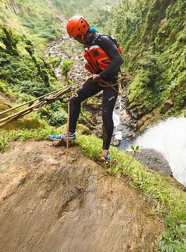 a man wearing a helmet and a life vest