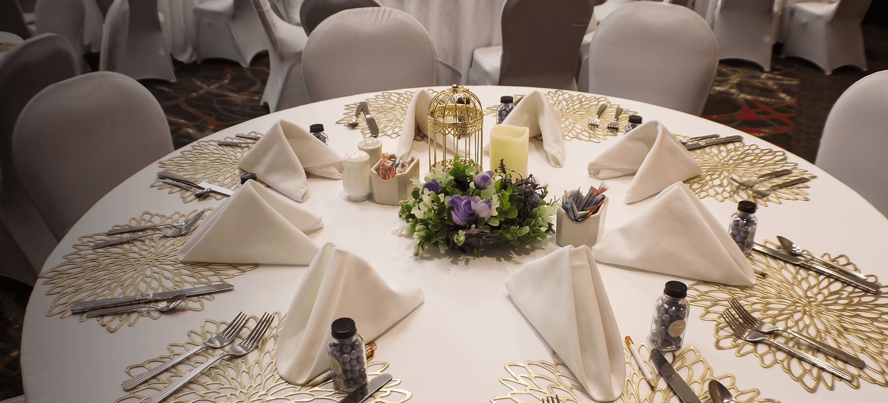 a table set with napkins and flowers