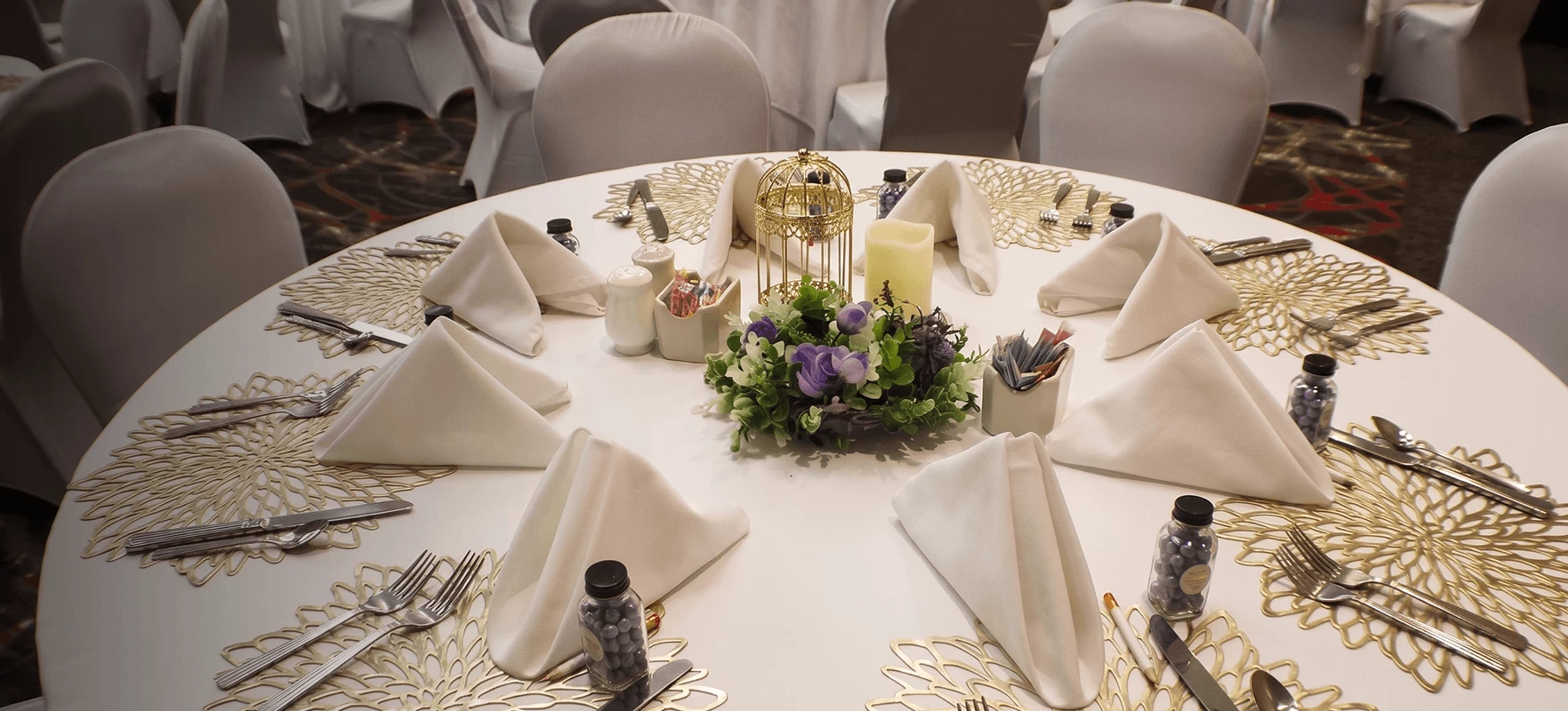 a table set with napkins and flowers