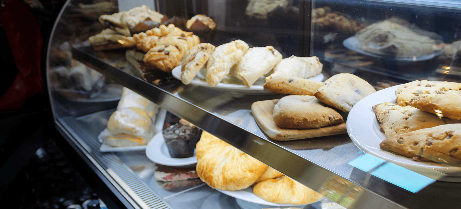 a display case with pastries