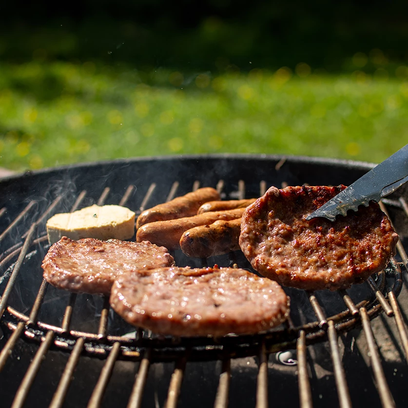 a grill with meat and sausages
