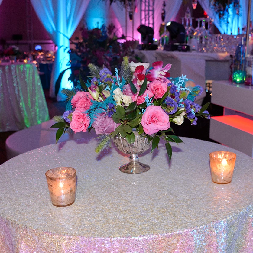 a table with flowers and candles