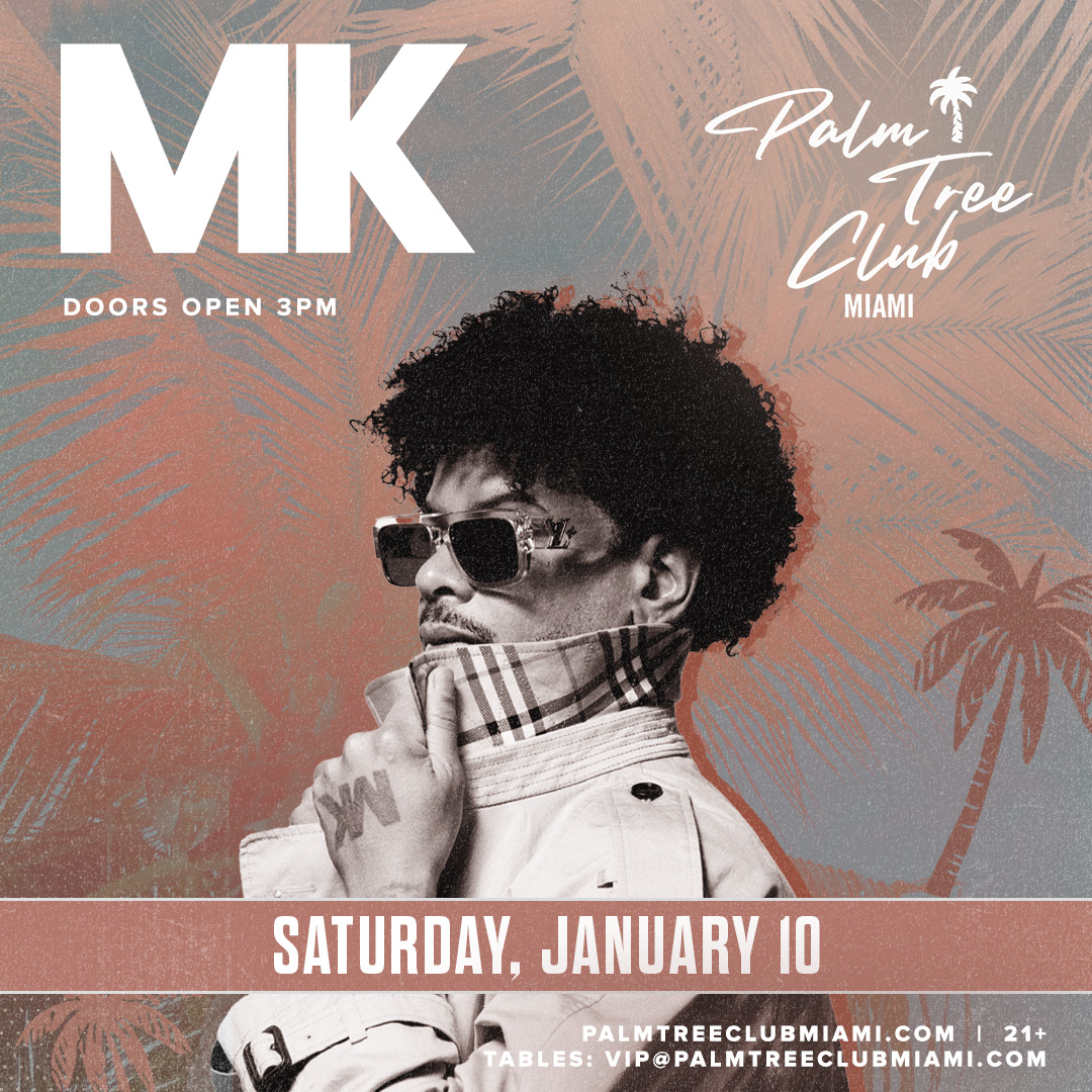 a man wearing sunglasses and a white jacket