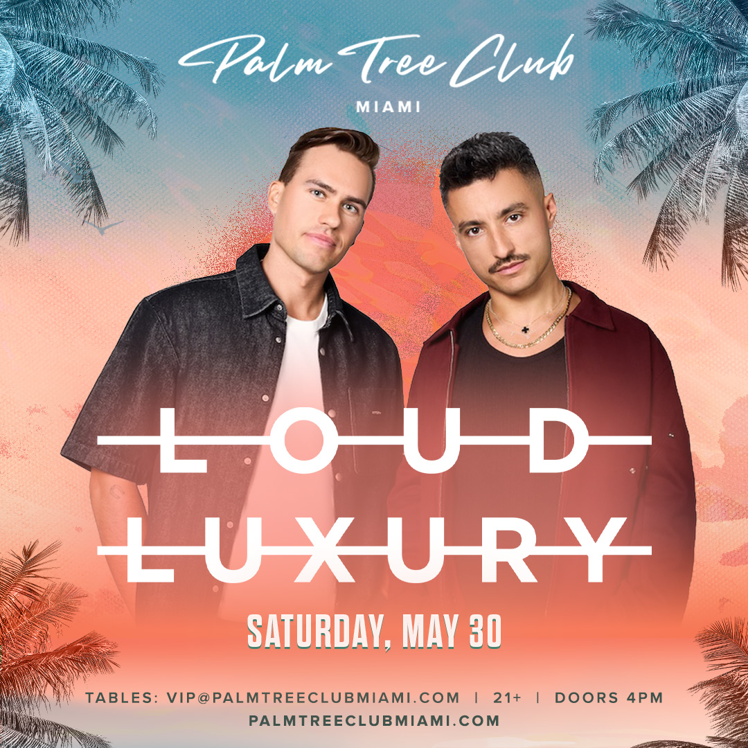 two men standing in front of a colorful background