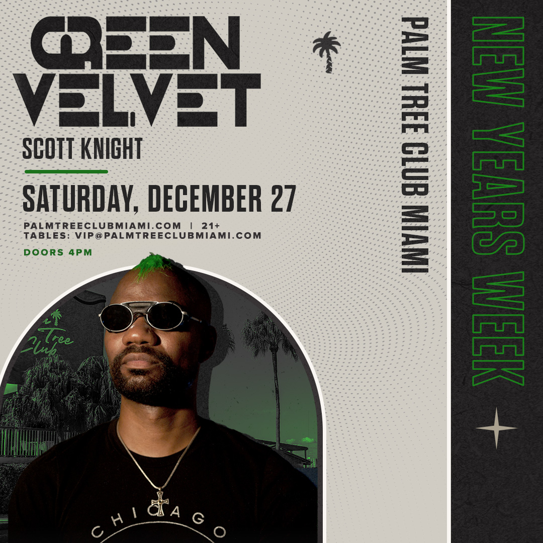 a man wearing sunglasses and a necklace