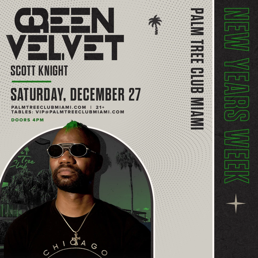 a man wearing sunglasses and a necklace