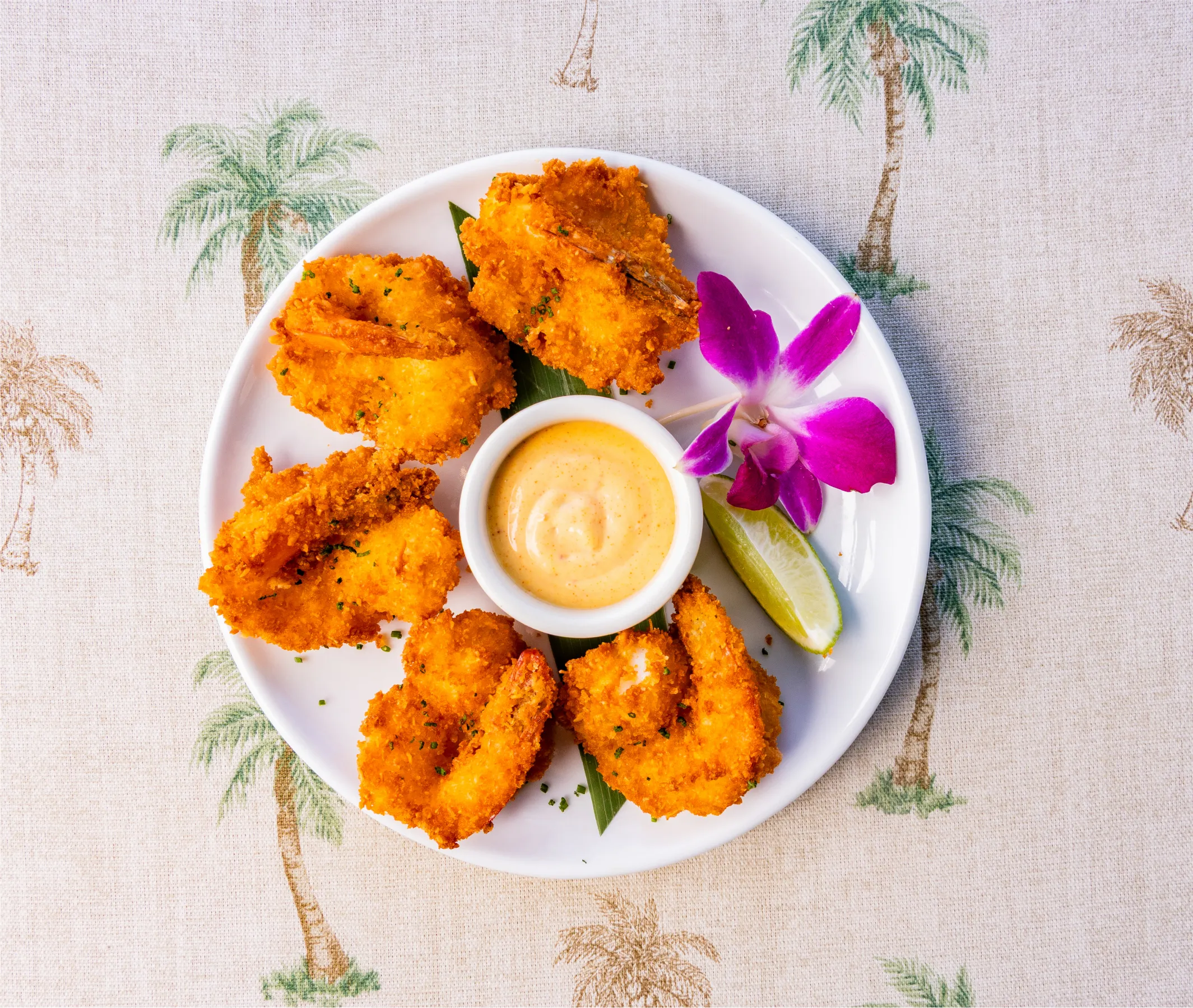 a plate of fried shrimp with sauce