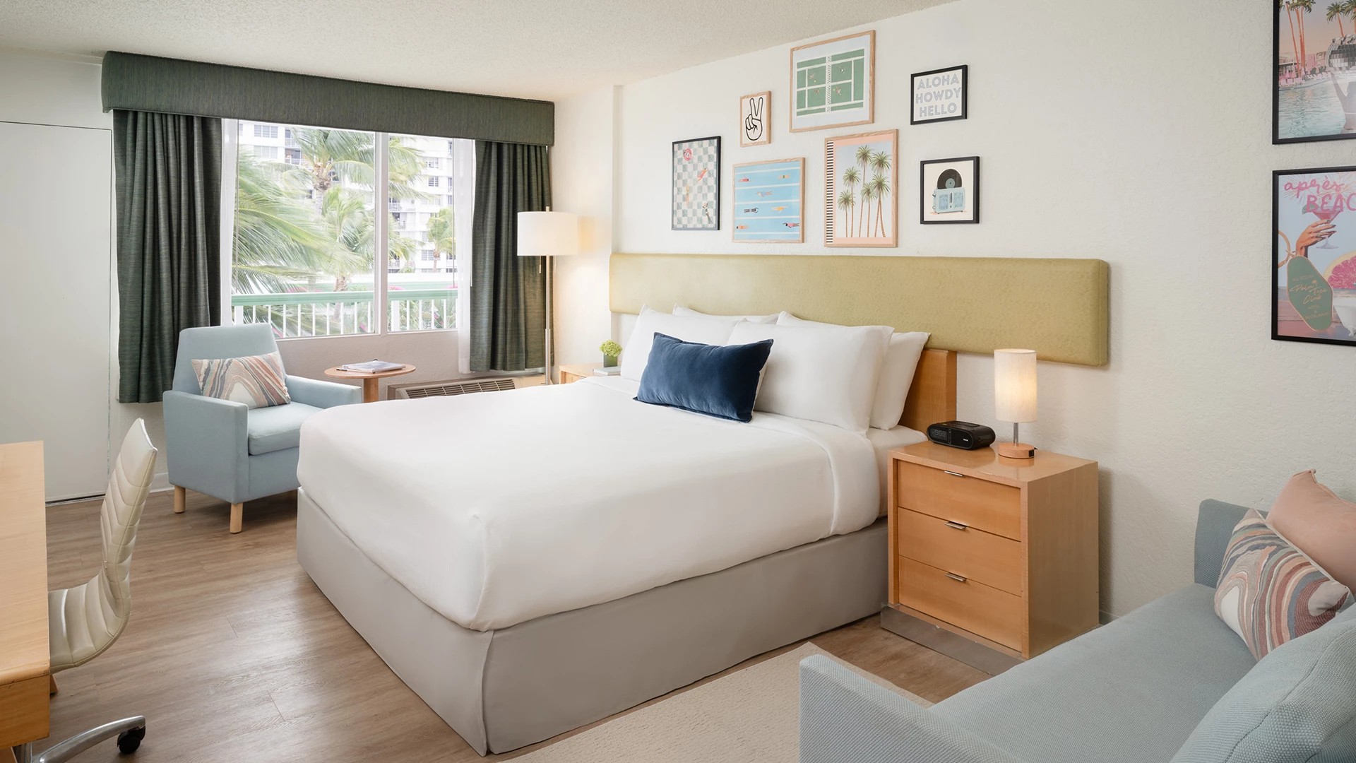 a hotel room with a bed and a chair