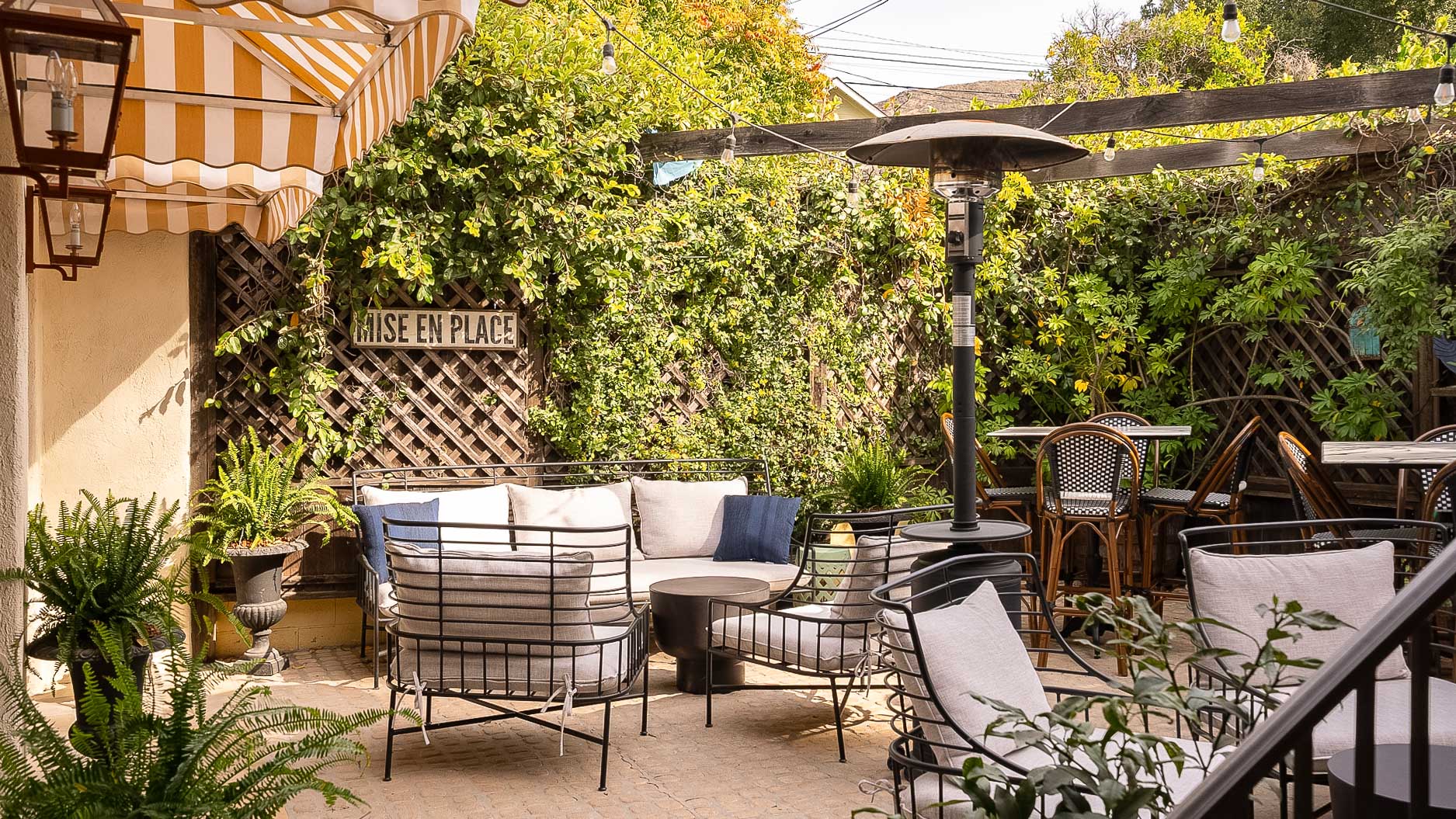A cozy outdoor seating area with furniture and plants
