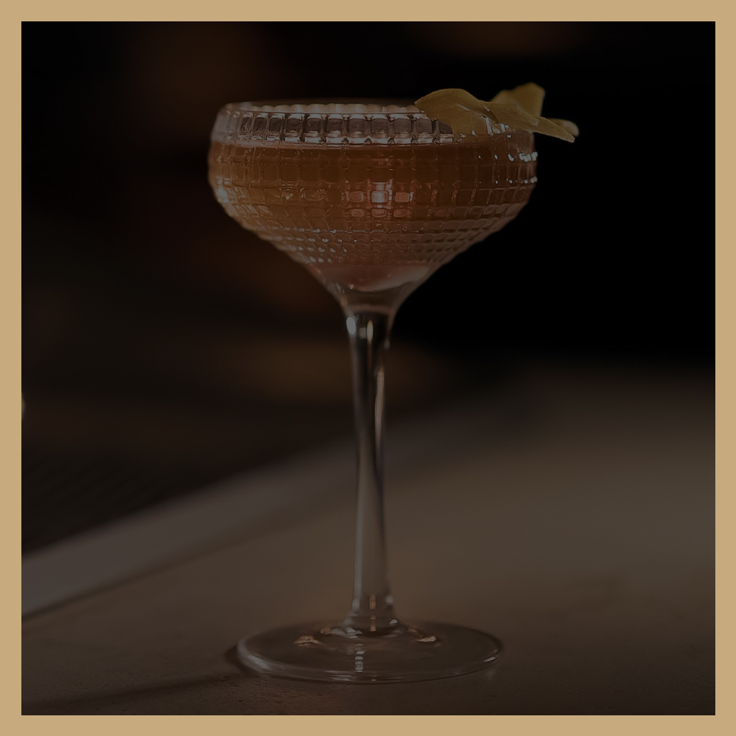 a glass with a drink in it