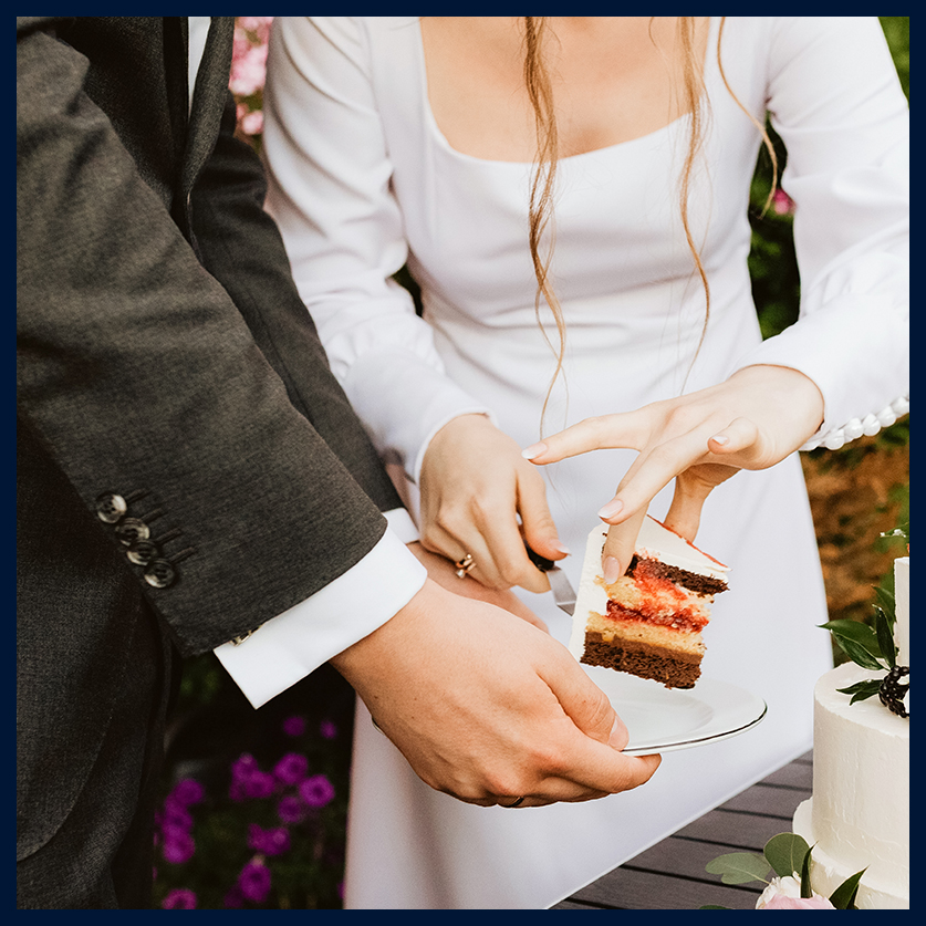 a man and woman cutting a cake