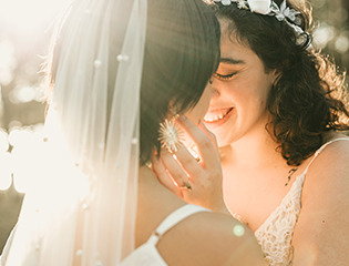 a woman touching another woman's face