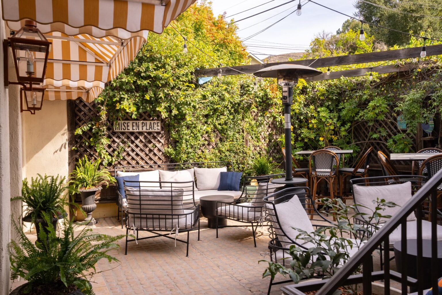 a patio with chairs and tables