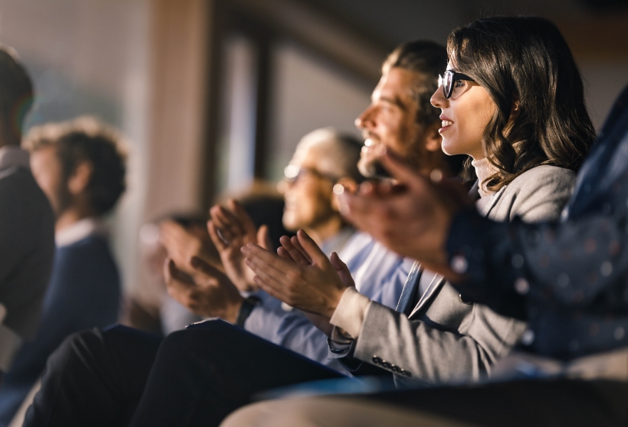 a group of people clapping