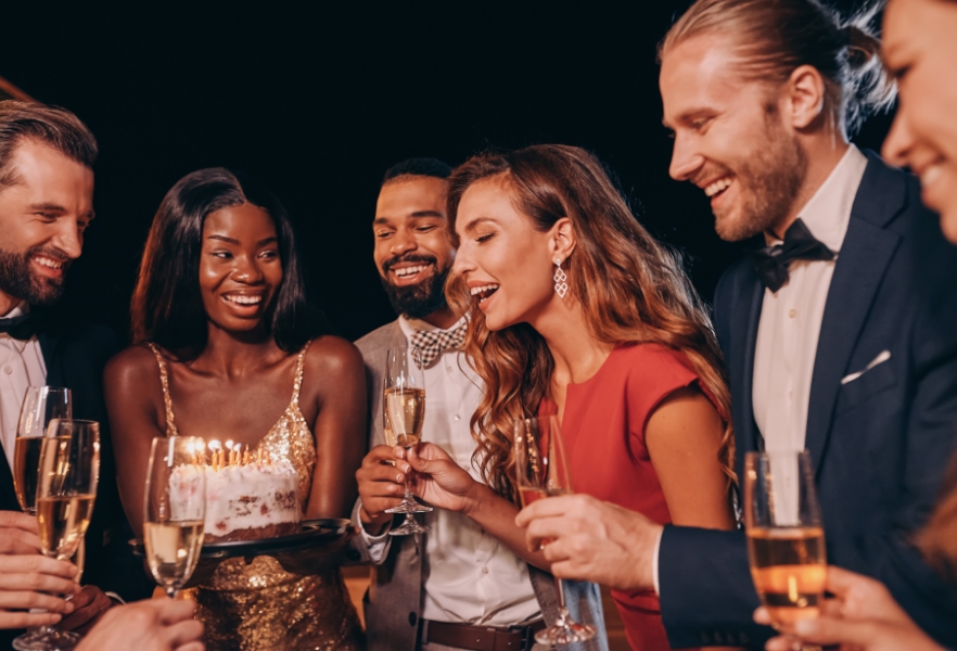 a group of friends holding wine glasses and celebrating