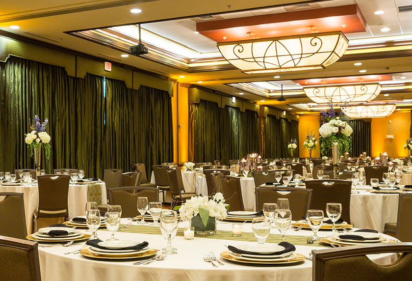 a large room with tables set for a meal