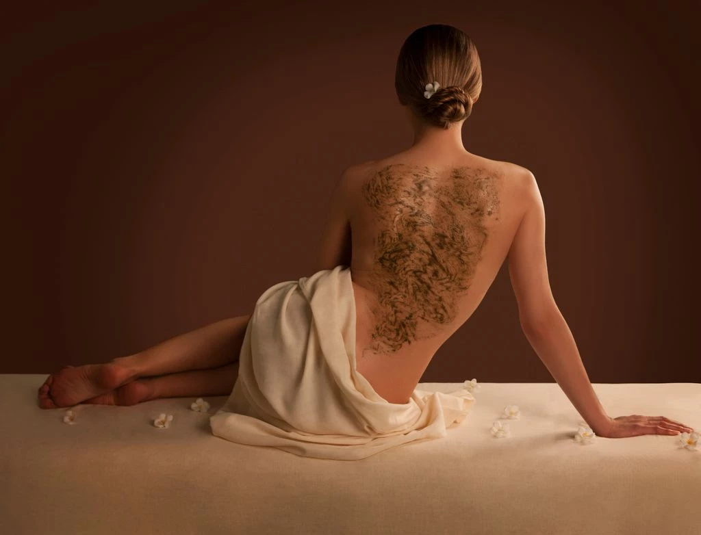 a woman with a tattoo on her back