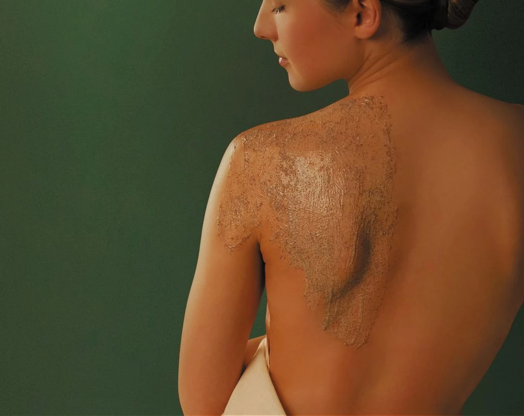a woman with brown scrub on her back