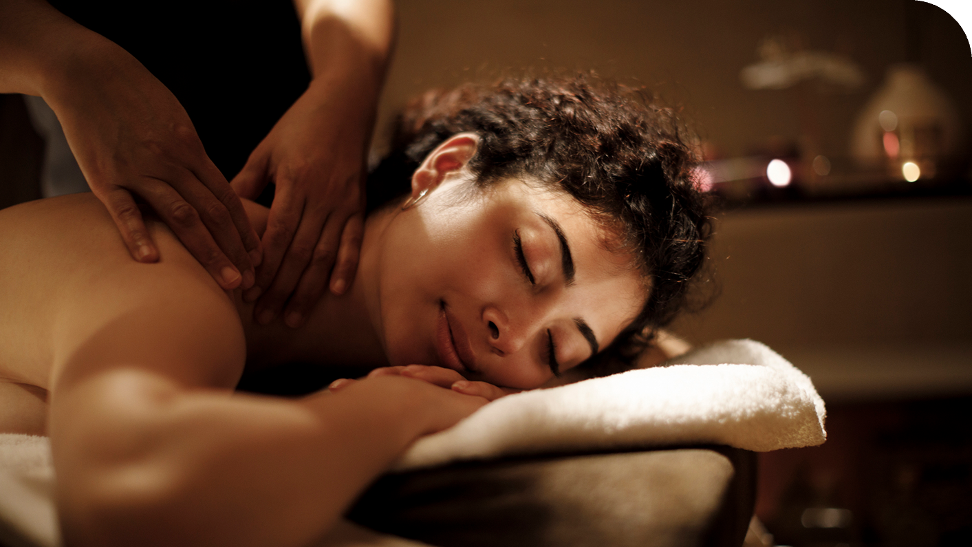 a woman lying down with her eyes closed