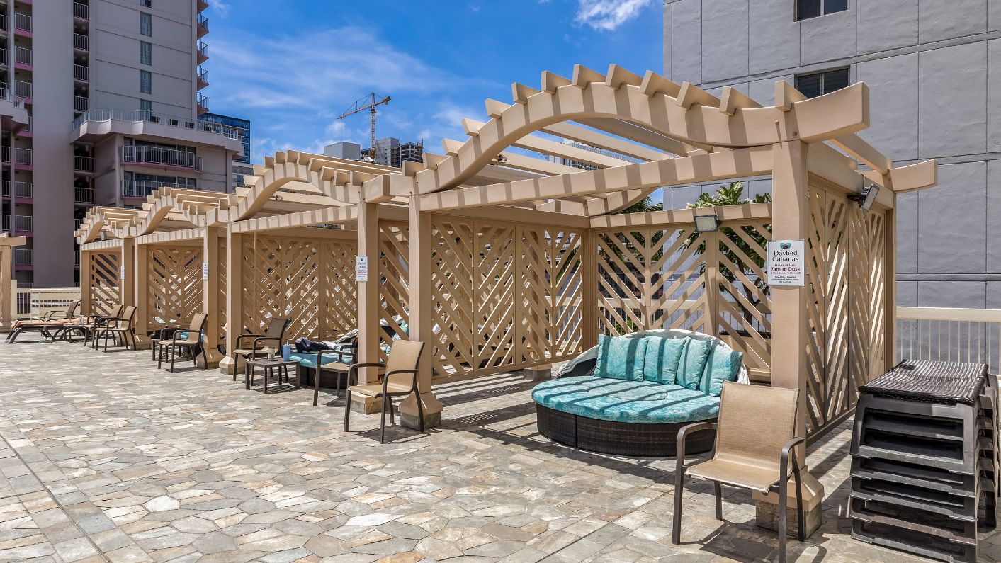 a patio with a couch and chairs