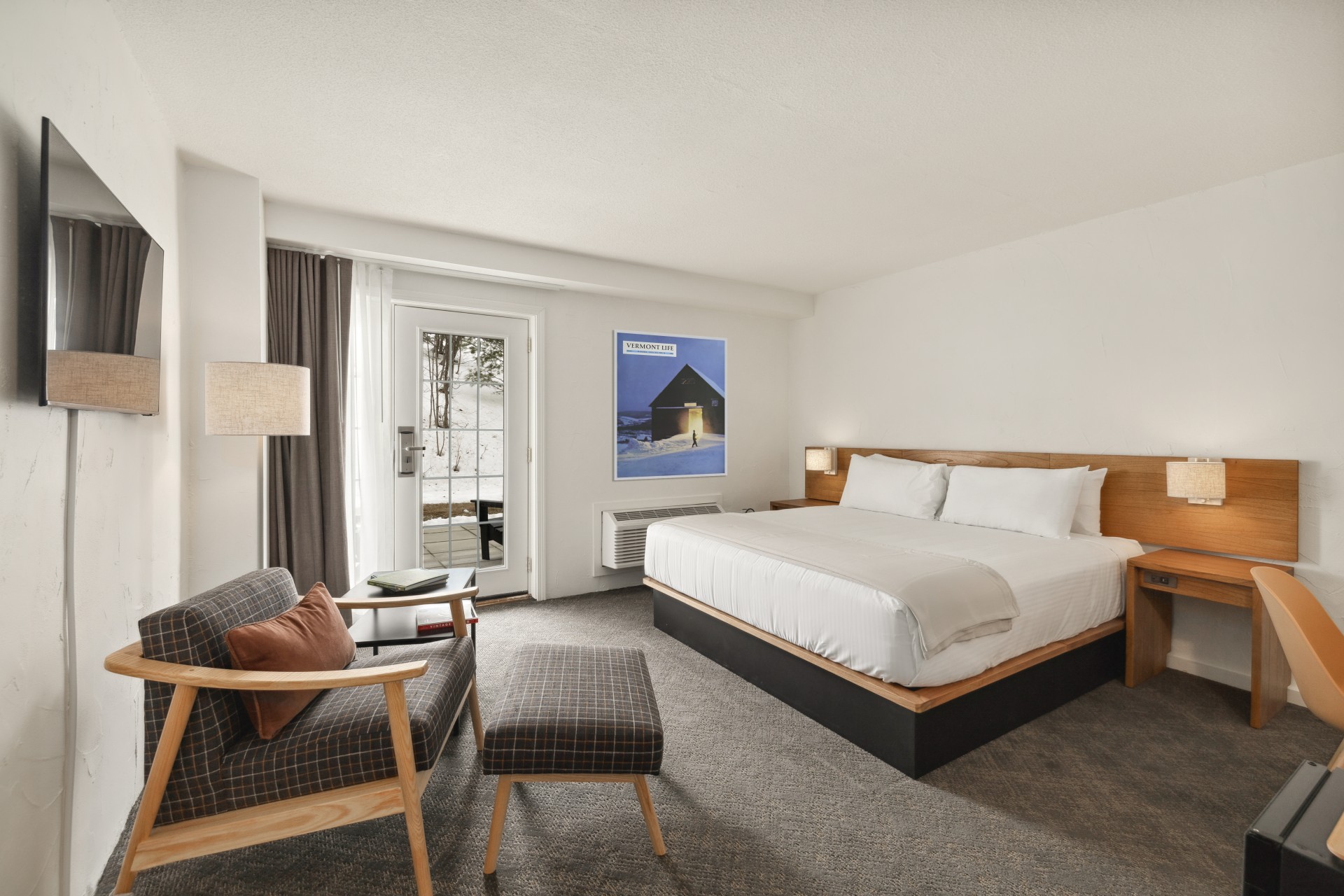 a room with a bed and chair