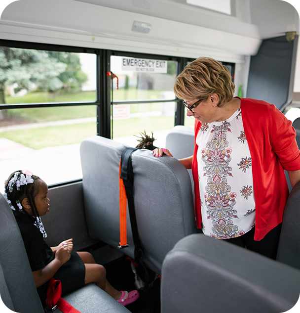a woman standing in a bus