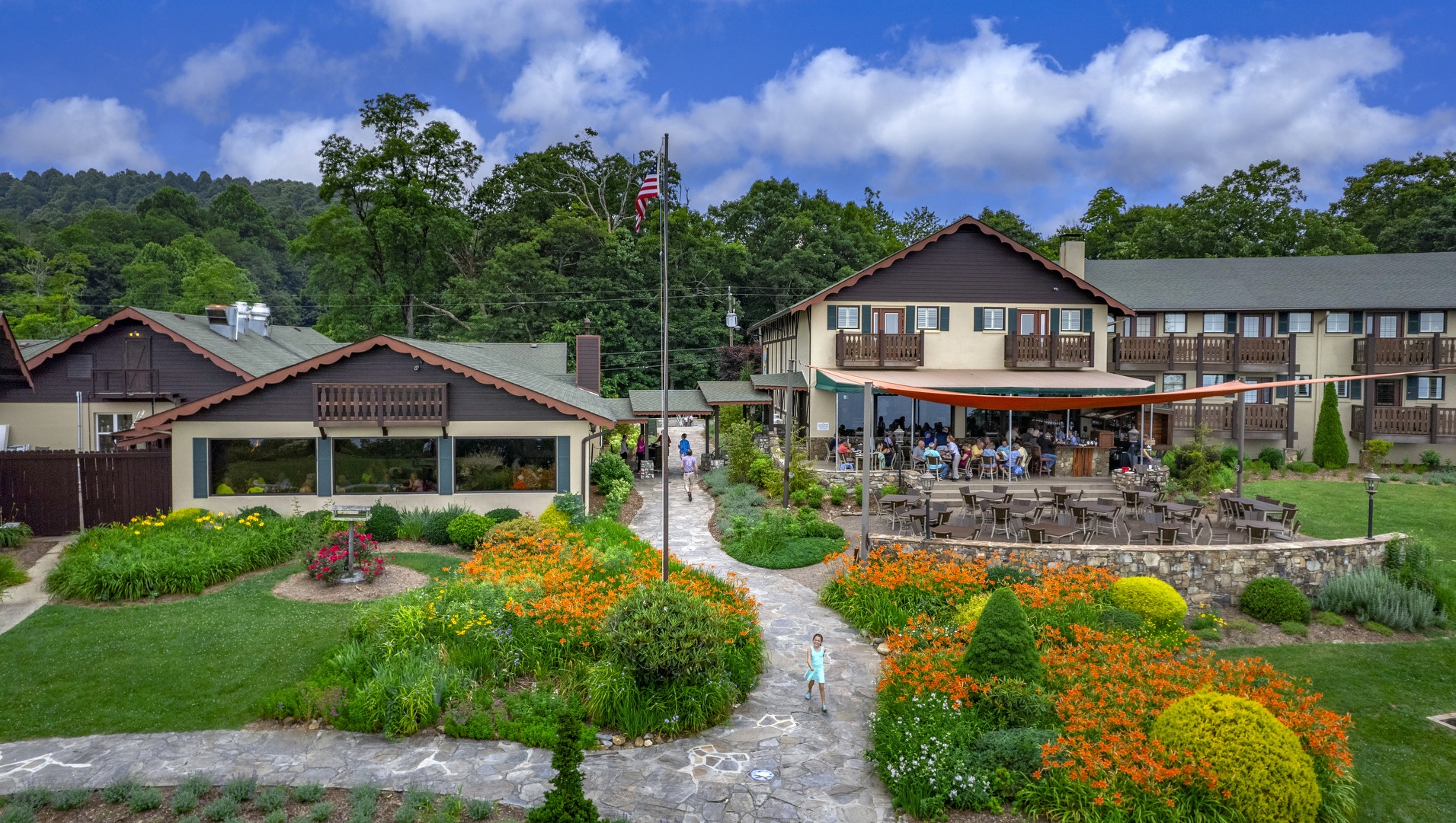 a group of people walking in front of a building