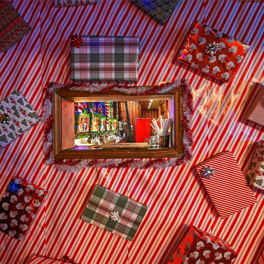 a mirror on a table with presents